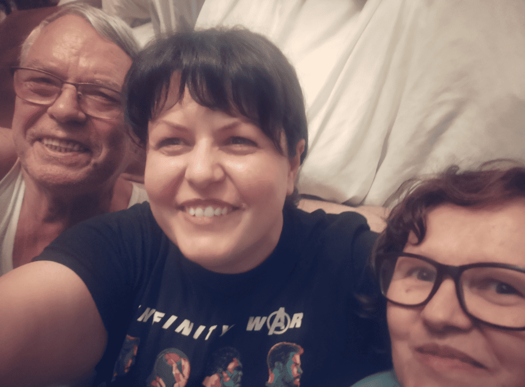 Rebeca Duriga, smiling in a selfie with her parents.