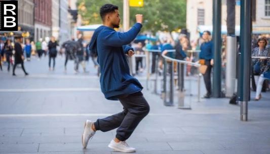 A person moving in the street.