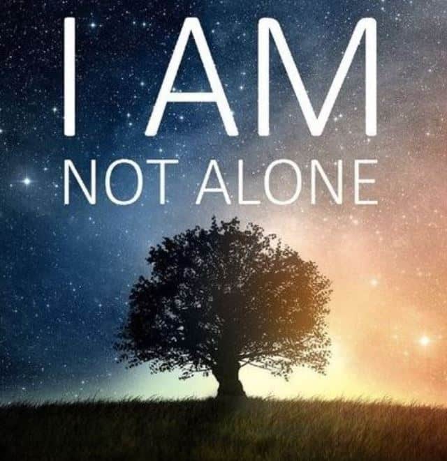 A tree with the message "I am not alone" above it.