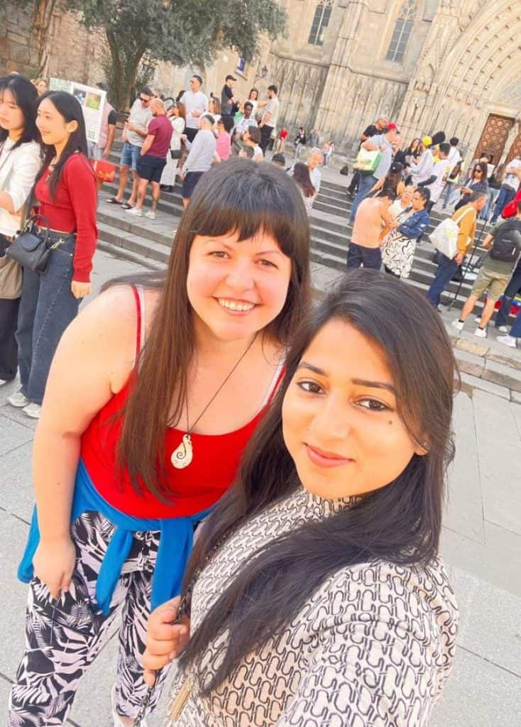 Rebeca Duriga with her friend Soniya taking a picture in front of the cathedral.